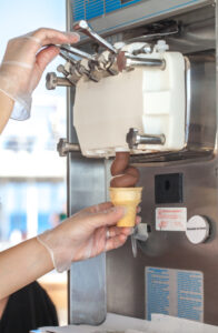 chocolate soft serve ice cream being dispensed by taylor machine