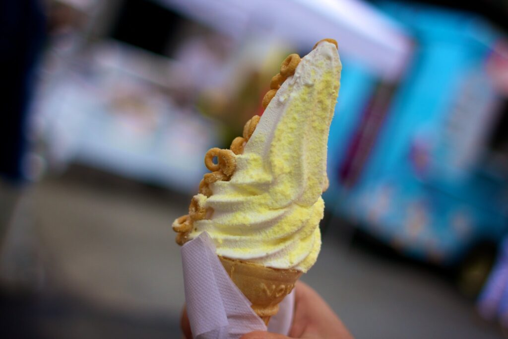 yellow ice cream cone with nuts