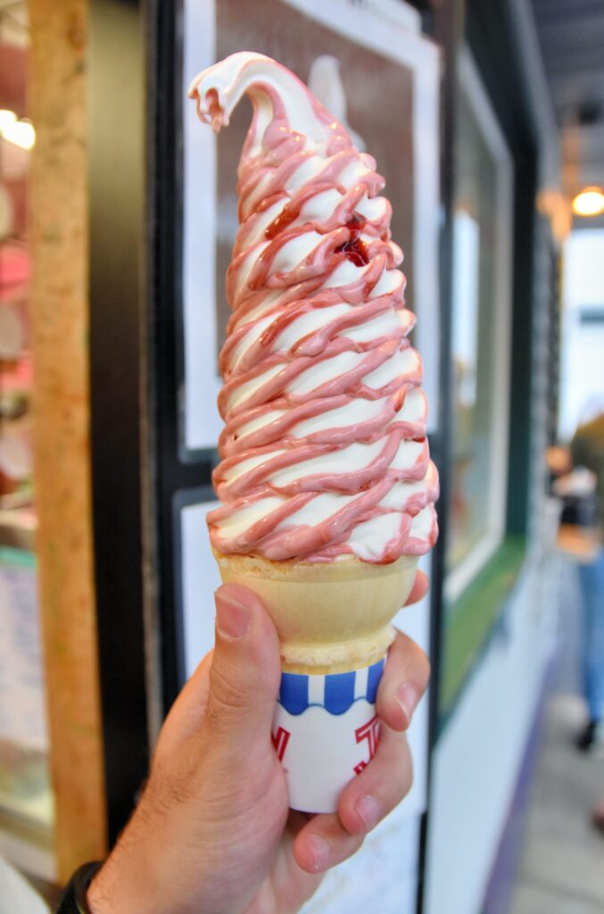 vanilla ice cream cone with red swirl